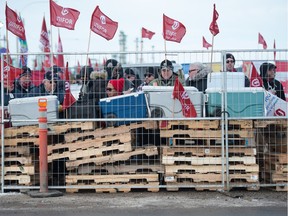 Following a breakdown in bargaining, Unifor picket line barricades were rebuilt outside the Co-op Refinery Complex at Gate 7 on Fleet Street in Regina on Feb. 1, 2020. Pickets are shown here collecting lunch from coolers stored inside the barricade.
