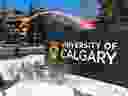 Students walk past a sign at the south entrance to the University of Calgary on Tuesday, Feb. 26, 2019.