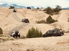 A GONE (Gathering of Nissan Enthusiasts) convoy just outside of the city of Moab, Utah. The event takes place every May and it is a test of skill and mettle of off-roaders. Val Fortney photo