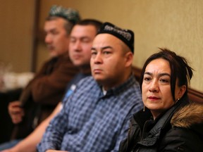 Members of Alberta's Uyghur community listen during a press conference in Calgary on Sunday, February 2, 2020. There is growing concern about the continued internment of Chinese Uyghur in China especially as the coronavirus spreads. Gavin Young/Postmedia
