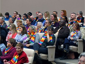 Supporters of a motion before council to ban conversion therapy in the Calgary attend a council session on Monday, February 3, 2020.