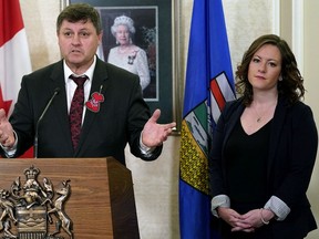 Rick Wilson, left, Alberta minister of Indigenous relations, and Rebecca Schulz, Alberta minister of children's services, answer questions at Government House in Edmonton on Feb. 12, 2020, after their meeting with Indigenous chiefs.