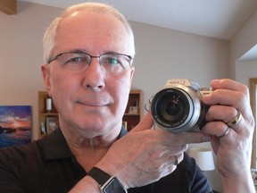 Camera buff Jim Phillipchuk of St. Alberta, Alta., with his latest camera. He has seen a lot of cameras come and go over the years. Handout