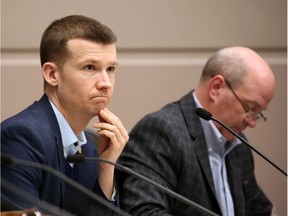 Calgary city councillors Jeromy Farkas, left and Peter Demong were photographed during a special meeting of council on Wednesday, February 19, 2020. Council met briefly before moving to an in camera meeting to discuss a possible forensic audit of Councillor Joe Magliocca's expenses. Gavin Young/Postmedia