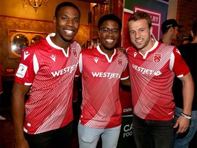Cavalry FC players (L-R) Elijah Adekugbe, Bruno Zebie and Nico Pasquotti pose with new  Cavalry FC home kit during the team unveil ceremony for the CPL team in Calgary on Thursday, February 27, 2020. Jim Wells/Postmedia