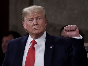President Donald Trump pumps his fist as he delivers the state of the union address in the chamber of the U.S. House of Representatives at the Capitol Building on Feb. 4, 2020 in Washington, DC.