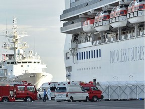 Personnel prepare to conduct a transfer from the quarantined Diamond Princess cruise ship in Yokohama, Japan, on Feb. 7, 2020.