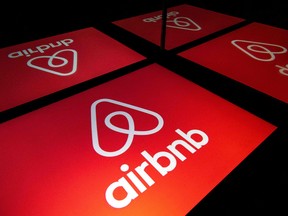 (FILES) This illustration file picture taken on November 22, 2019, shows the logo of the online lodging service Airbnb displayed on a tablet in Paris. - Online short-term rental platform Airbnb scored a victory against French hoteliers December 19, 2019 when the European Court of Justice ruled that the US giant is not an estate agent. The ECJ ruled that Airbnb can be considered "an 'information society service', distinct from the subsequent service to which it relates." The French hotel industry lobby had brought the case arguing that Airbnb operates as a property rental firm and should be regulated as such under French law. (Photo by Lionel BONAVENTURE / AFP) (Photo by LIONEL BONAVENTURE/AFP via Getty Images)