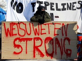 Supporters of Wet'suwet'en Nation's hereditary chiefs camp at a railway blockade in Edmonton on Feb. 19.