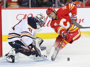 The Calgary Flame Derek Ryan comes close in a quick break-away against Edmonton Oilers goalie Mike Smith during NHL action in Calgary on Saturday, February 1, 2020.  Gavin Young/Postmedia