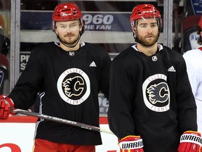 Calgary Flames defencemen Rasmus Andersson, left and TJ Brodie were photographed during team practise at the Scotiabank Saddledome on Wednesday, February 5, 2020. The Flames are looking at options after team captain and defenceman Mark Giordano was injured the night before during a game against the San Jose Sharks. Gavin Young/Postmedia