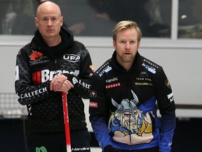 Canada’s Kevin Koe, left, and Swedish skip Niklas Edin watch a shot in the final of the ATB Glencoe Invitational Bonspiel at the Glencoe Club in Calgary on Sunday, February 16, 2020.