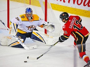 Calgary Flames forward Johnny Gaudreau lines up a shot on Nashville Predators goaltender Juuse Saros during NHL action at the Scotiabank Saddledome in Calgary on Saturday December 8, 2018. Gavin Young/Postmedia