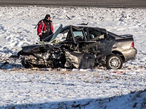 Calgary police officer at the scene of a fatal crash on Stony Trail in north Calgary on Tuesday, Feb. 4, 2020.