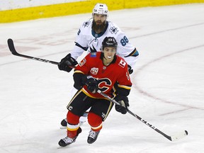 Calgary Flames, Johnny Gaudreau is shadowed by San Jose Sharks, Brent Burns in third period action of at the Scotiabank Saddledome in Calgary on Tuesday, February 4, 2020. Darren Makowichuk/Postmedia