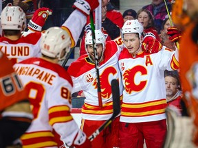 Feb 17, 2020; Calgary, Alberta, CAN; Calgary Flames left wing Matthew Tkachuk (19) celebrates his goal with teammates against the Anaheim Ducks during the third period at Scotiabank Saddledome. Mandatory Credit: Sergei Belski-USA TODAY Sports ORG XMIT: USATSI-405909