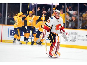 Feb 27, 2020; Nashville, Tennessee, USA; Calgary Flames goaltender David Rittich (33) skates off the ice after allowing the game-winning goal to Nashville Predators center Mikael Granlund (64) in overtime at Bridgestone Arena. Mandatory Credit: Christopher Hanewinckel-USA TODAY Sports ORG XMIT: USATSI-405984