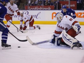 Carolina Hurricanes emergency goaltender David Ayres defends against Toronto Maple Leafs forward Zach Hyman at Scotiabank Arena. Carolina defeated Toronto.