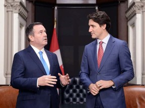 Alberta Premier Jason Kenney meets with Prime Minister Justin Trudeau on Parliament Hill in Ottawa on Dec. 10, 2019. At some point, Canada will debate health versus economy as social distancing restrictions and COVID-19 strangle activity, says columnist.