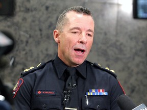 Calgary Police Chief Mark Neufeld speaks to reporters following a Calgary Police Commission public meeting on Tuesday, Feb. 25, 2020.