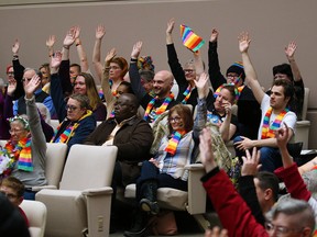 Supporters of a motion before council to ban conversion therapy in the Calgary attend a council session on Monday, Feb. 3, 2020.