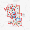 A map of the city of Calgary. Black lines represent the city’s current ward boundaries and red lines represent the proposed boundaries for the city’s second scenario. Courtesy City of Calgary.