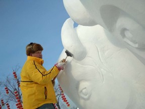 Artist Morton Burke travelled from his hometown, Sundre, Alta. to compete with an international team at the Harbin Ice and Snow Festival in China. His team's snow sculpture of bison titled "Power of Nature" was awarded gold in the category of Excellence in Sculpture. Photo supplied by Beata Rostas Facebook. ORG XMIT: oqFw-NSbMYDGGW0w1Qf2