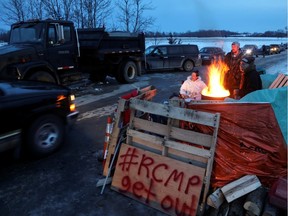 First Nations members of the Tyendinaga Mohawk Territory block train tracks servicing Via Rail, as part of a protest against British Columbia's Coastal GasLink pipeline, in Tyendinaga, Ontario. Feb. 12, 2020.