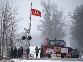 First Nations members of the Tyendinaga Mohawk Territory block train tracks servicing Via Rail, as part of a protest against British Columbia's Coastal GasLink pipeline, in Tyendinaga, Ontario, Canada February 13, 2020. REUTERS/Chris Helgren ORG XMIT: GGGTYE108