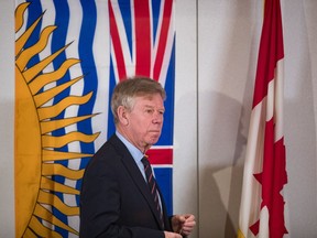 Commissioner Austin Cullen looks over the hearing room before opening statements at the Cullen Commission of Inquiry into Money Laundering in British Columbia, in Vancouver, on Monday, February 24, 2020.