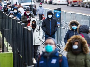 People line up to get a test at Elmhurst Hospital due to coronavirus outbreak on March 24, 2020 in Queens, New York, United States. There are now more than 35,000 cases of COVID-19 in the United States as governments scramble to contain the spread.