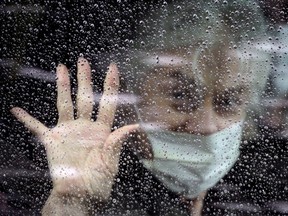 Judie Shape, 81, who had been diagnosed with coronavirus disease (COVID-19) and was a resident at Life Care Center of Kirkland, the long-term care facility linked to confirmed coronavirus cases in the state, leaves the center with her daughter, Lori Spencer, Kirkland, Washington, U.S. March 26, 2020.