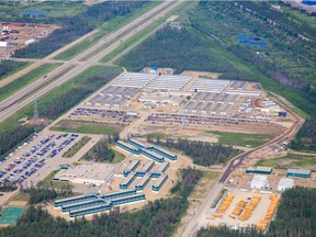 An aerial view Suncor's Millennium Lodge which accommodates up to 2,400 people and Borealis Lodge which houses 3,500 people and serves 11,000 meals per day are seen in this June 2013 file photo.