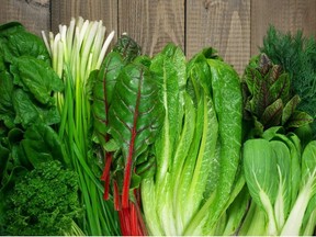 Spring vitamin set of various green leafy vegetables on rustic wooden table. Getty Images/iStock Photo