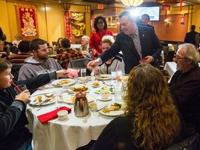 Premier Jason Kenney chats with diners before having dinner in the Silver Dragon restaurant in Calgary's Chinatown on Saturday, Feb. 1, as a show of support. Calgary city councillors similarly dined in Chinatown as well.