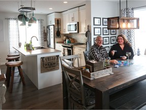 Now closer to the mountains, Taylor and Brandy Reed love their new Vantage Fireside home built by Cambridge Homes, in Cochrane.