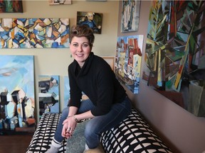 Artist Katie Leahul, surrounded by her canvases, is the artist for this year's Stampede Dream Home by Homes by Avi.