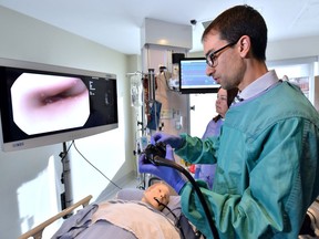 Dr. Paul Belletrutti, gastroenterologist in Peter Lougheed Centre, and nurse Leslie Peoples demonstrates an innovative surgery using a flexible video camera called endoscope on Tuesday, March 3, 2020.