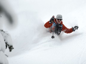 The author in waist deep powder. Photo by Matt Mosteller.