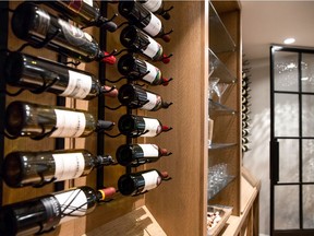 In a wine cellar, plan for racks for displaying wine bottles of varying sizes, as well as storing crates.