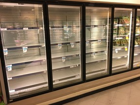Empty shelves greet customers on Friday, March 13, 2020. Darren Makowichuk/Postmedia