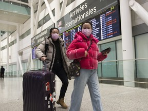 Passengers arrive at the International terminal at Toronto Pearson International Airport on Jan. 25, 2020.