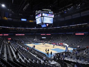 Fans leave after an announcement that the Oklahoma City Thunder vs. Utah Jazz game is cancelled just before the tip off at Chesapeake Energy Arena.