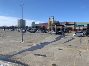 The parking lot at Chinook Centre was mostly empty as Calgarians heeded advice to socially distance themselves to help prevent the spread of COVID-19 on Tuesday, March 17, 2020.  Gavin Young/Postmedia