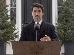 Prime Minister Justin Trudeau gestures as he responds to a question from the media about Canada's response to the COVID-19 virus in Ottawa, Tuesday March 17, 2020.