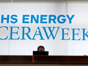 FILE PHOTO: An attendee works on a laptop at the annual IHS CERAWeek conference in Houston, Texas March 4, 2014.  REUTERS/Rick Wilking/File Photo ORG XMIT: FW1