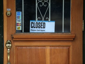 Closed storefront in downtown Calgary on Tuesday, March 24, 2020. We should find ways to resume the economy as soon as possible, says columnist Danielle Smith.