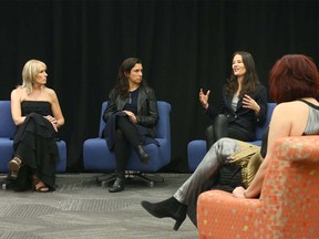 YW Calgary CEO Sue Tomney, left, and New York Times journalists Jodi Kantor and Megan Twohey speak to media and guests in Calgary on Wednesday, March 4, 2020.