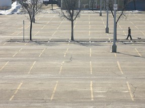 A nearly empty parking lot at Chinook Centre is shown on late Sunday morning on Sunday, March 22, 2020.