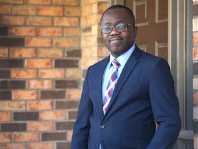 Victor Aduayi poses at his southwest Calgary home on Friday, March 27, 2020. Foreign doctors without full qualifications are frustrated at being sidelined during the COVID-19 crisis. Jim Wells/Postmedia